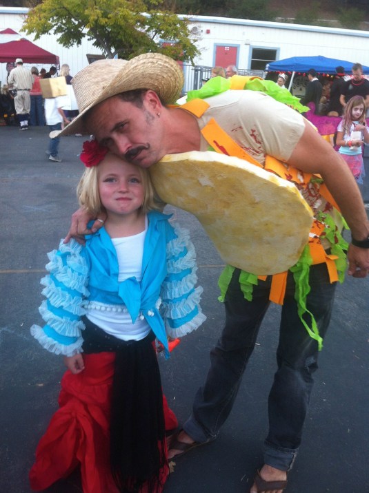 The author in taco costume with friend Lucy at the Halloween carnival, 2012