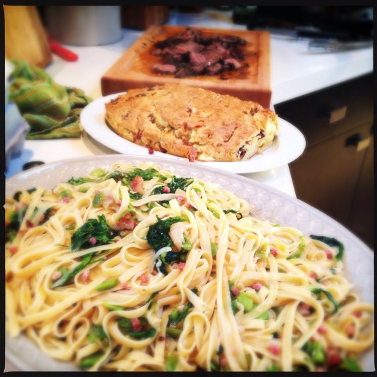 Fettuccine with fava beans, savory Pascal bread, garlic & rosemary leg of lamb