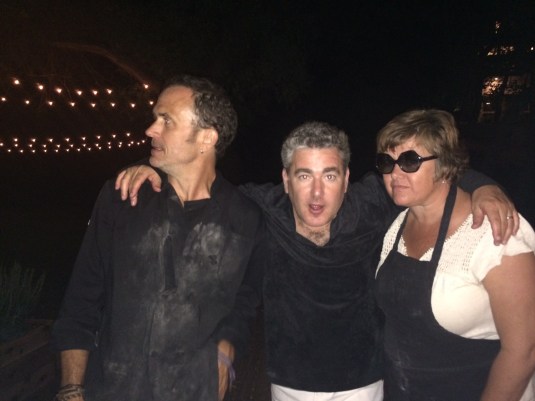 Kitchen staff under the continuing duress of alcohol at the wood oven