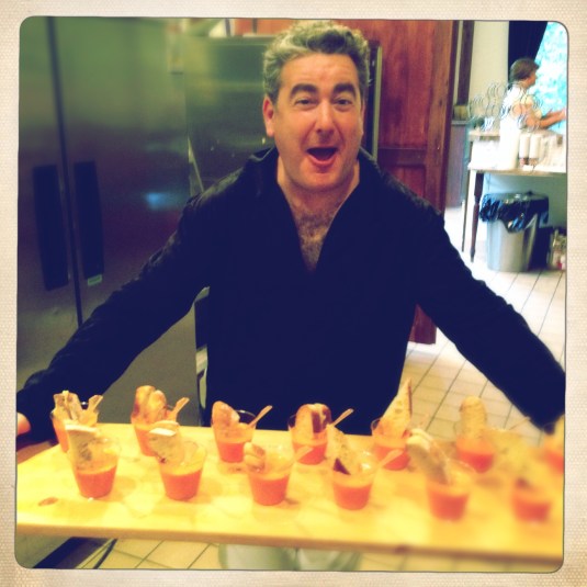 Don Schneider with a wood plank full of gazpachos