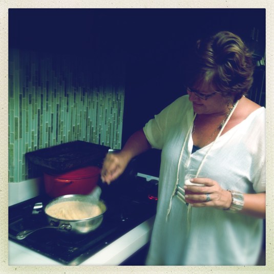 Katy stirring the cheese for the mac