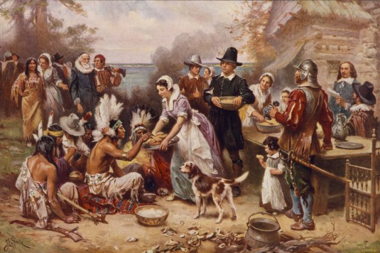 Kind conquerors feeding the savage Indians at the first Thanksgiving