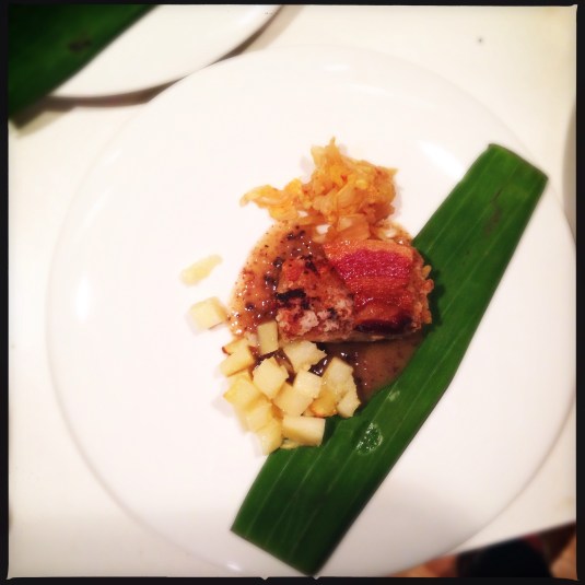 Course 5: "Meat 1" — steamed pork belly packages, roast parsnip compote, Iberico pig crisp, fermented Napa cabbage, morcilla sauce