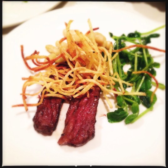 Course 6: "Meat II" — zabuton tiny steak, flageolet beans, matchstick potatoes, spiced pea shoots, wasabi butter