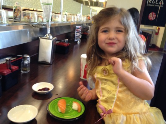 Imogen enjoying her salmon at Kula