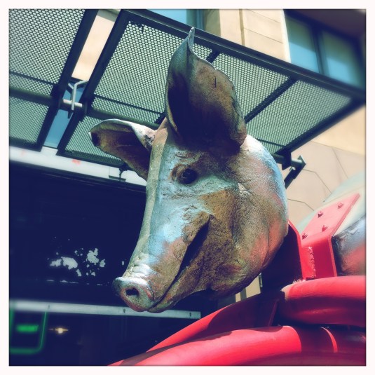 A pig's head outside the market welcomes you — a nod to tradition