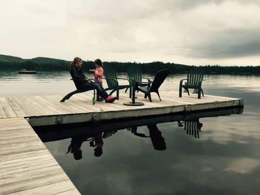 Leslie and Immy sitting on the dock of the bay