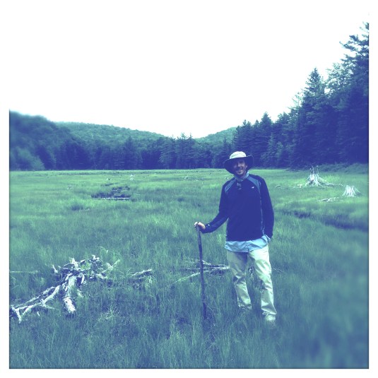 Jon with his beaver stick, hunting the glacial erratics