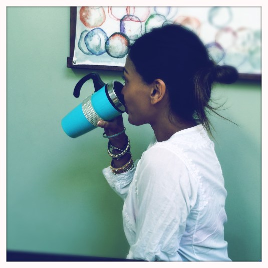 Shoba and her fancy drink, avoiding the camera's lens