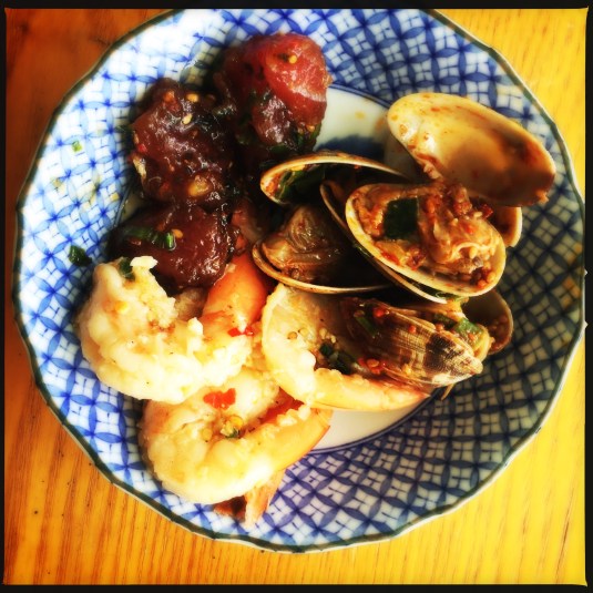 Ahi, garlic shrimp and clam kim chee pokes from Shima's Supermarket
