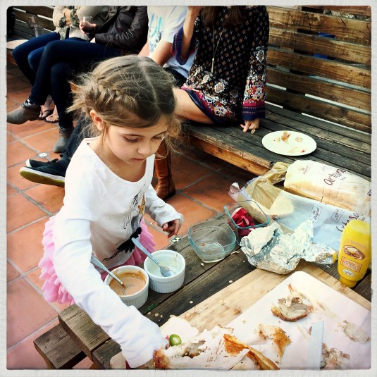 Immy making sandwiches to order